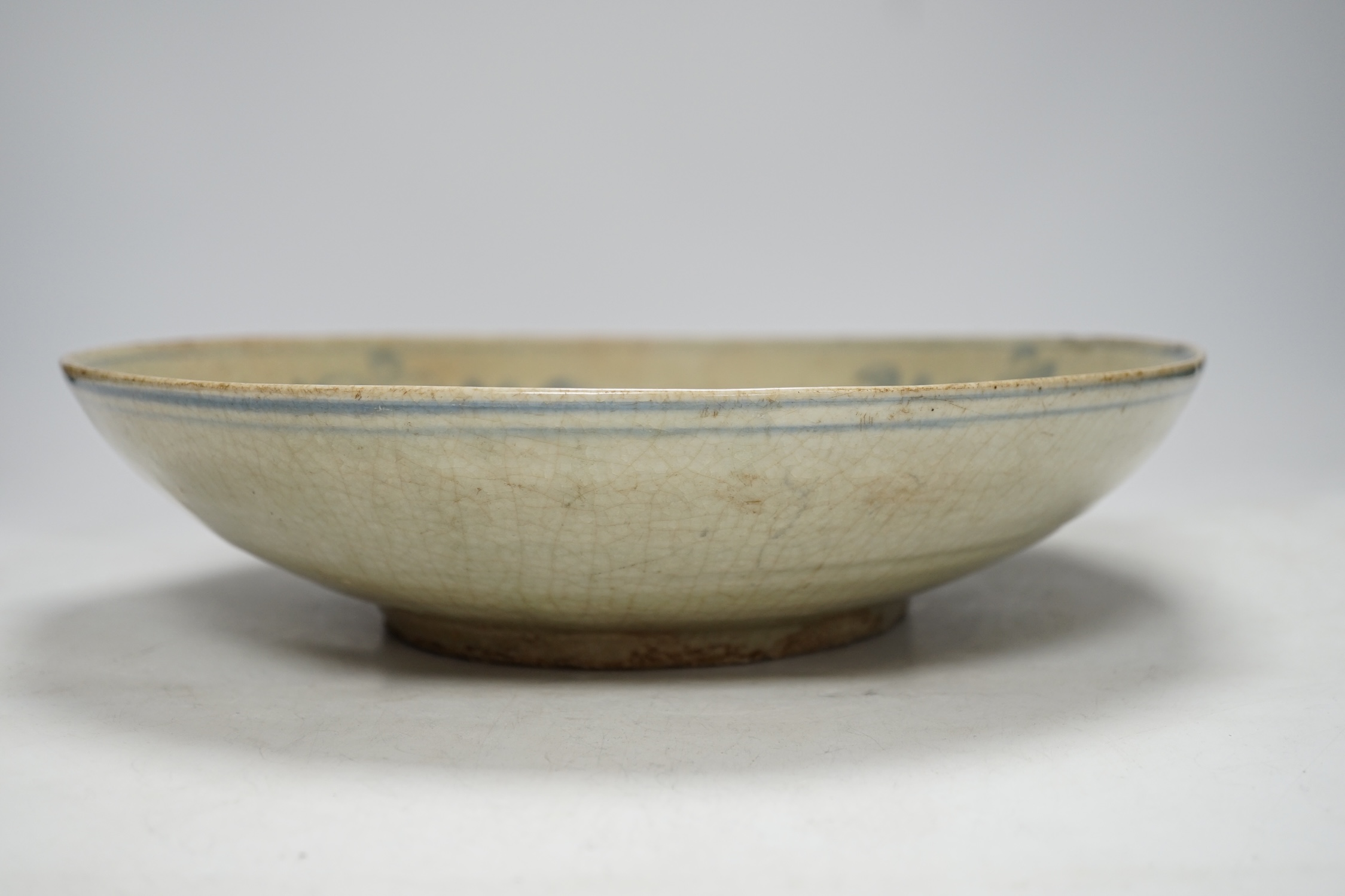 A Chinese Swatow blue and white dish, 17th century, 32cm diameter